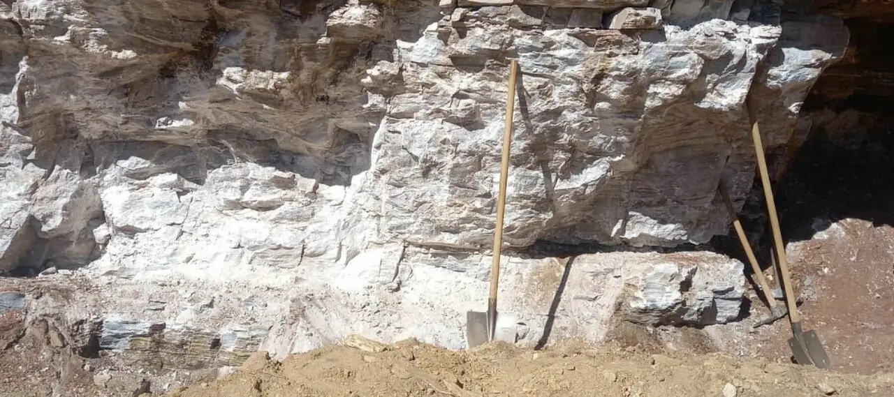 White barite exposed in the rock at a mine site